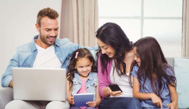 Image of a family enjoying their digital devices 